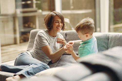 A monther enjoying time with her son because she isn't affected by her C.I.R.S.